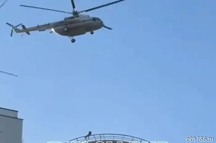 In Yekaterinburg, a man descended from a helicopter onto the roof of a high-rise building.
