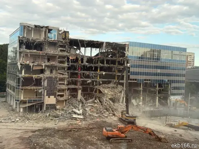 Next to the Green Grove, a huge glass building is being demolished.